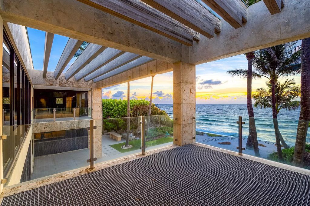 This 6-bed, 6-bath home features a soaring great room with ocean views, a fabulous new chef's kitchen, a guest house, and a resort-style outdoor oasis complete with an infinity pool, koi pond with fountain, and Intracoastal dock