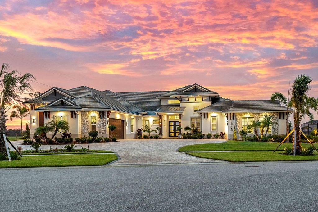 This brand-new 2024 lakefront estate, set on 0.75 acres, offers 4 bedrooms, 7 baths, and 6,299 square feet of refined living space.