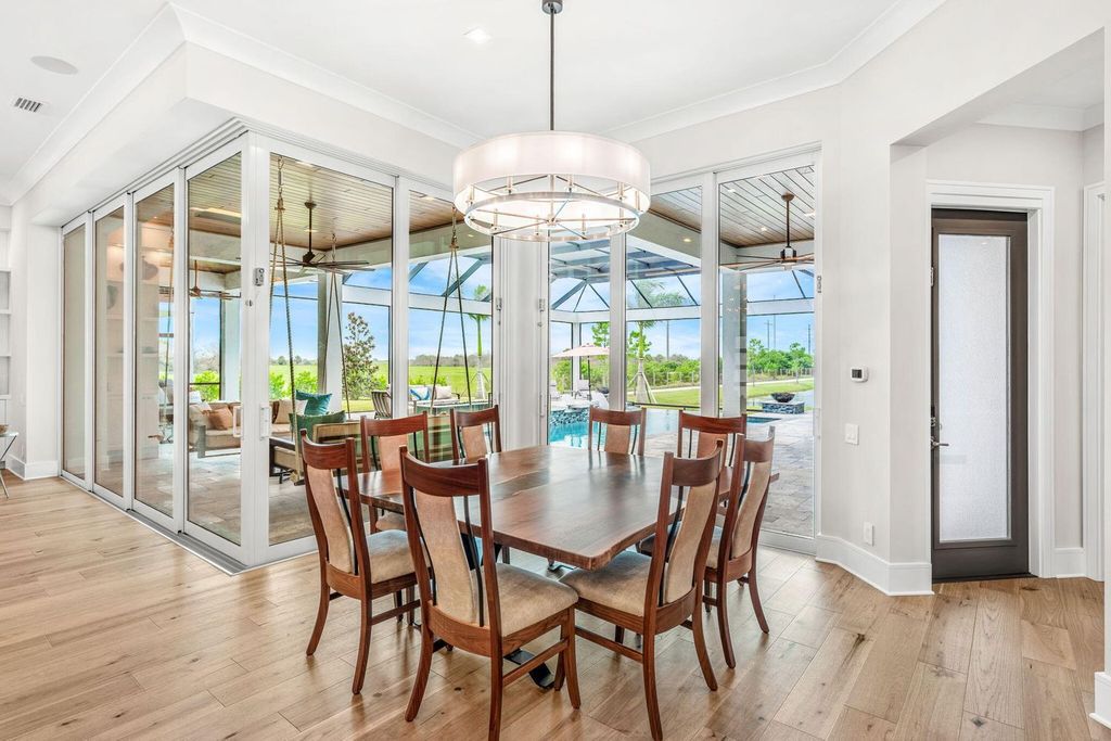 This brand-new 2024 lakefront estate, set on 0.75 acres, offers 4 bedrooms, 7 baths, and 6,299 square feet of refined living space.