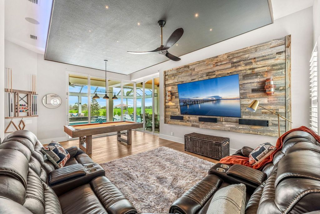 This brand-new 2024 lakefront estate, set on 0.75 acres, offers 4 bedrooms, 7 baths, and 6,299 square feet of refined living space.