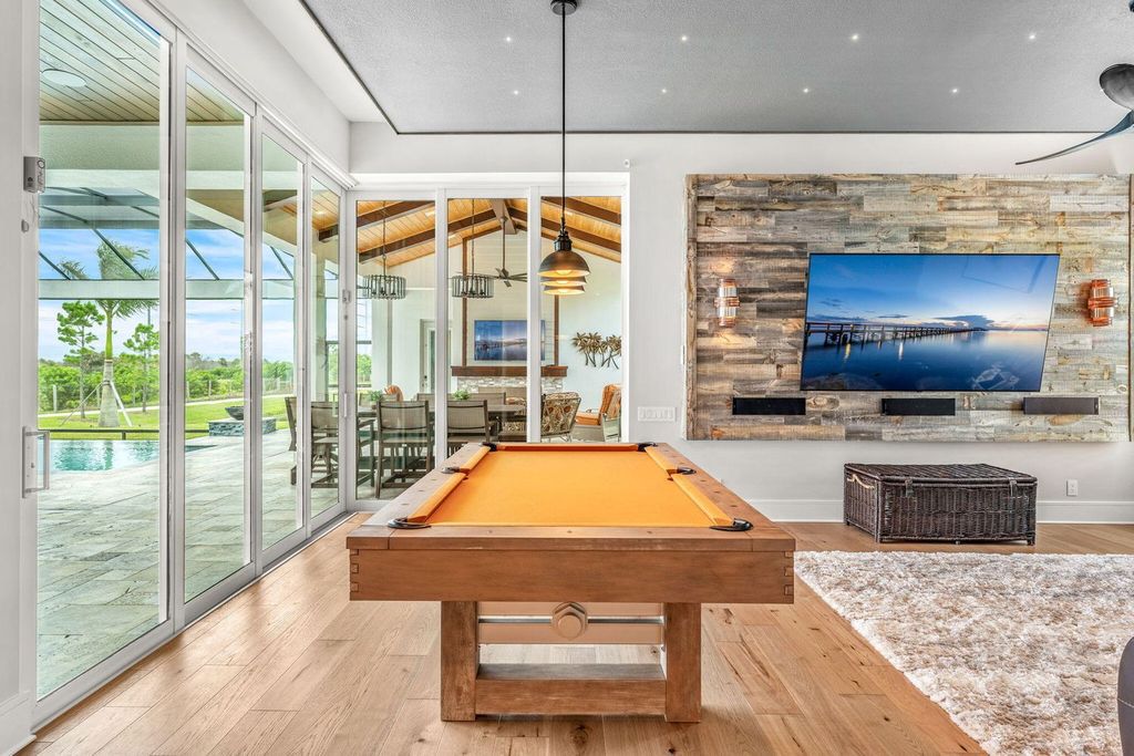 This brand-new 2024 lakefront estate, set on 0.75 acres, offers 4 bedrooms, 7 baths, and 6,299 square feet of refined living space.