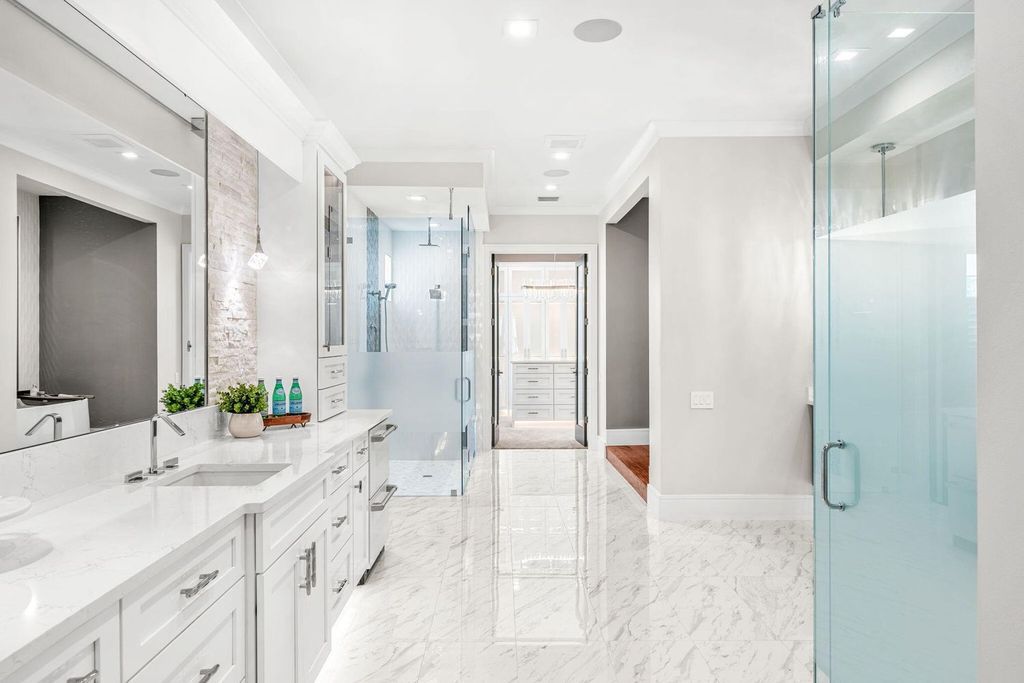 This brand-new 2024 lakefront estate, set on 0.75 acres, offers 4 bedrooms, 7 baths, and 6,299 square feet of refined living space.