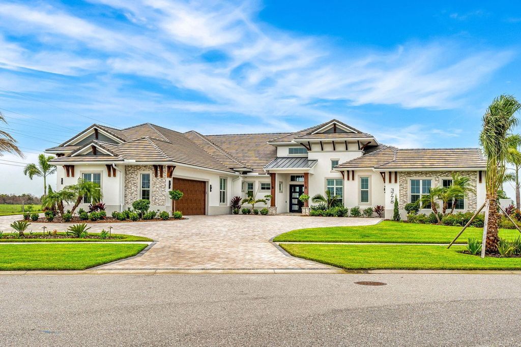This brand-new 2024 lakefront estate, set on 0.75 acres, offers 4 bedrooms, 7 baths, and 6,299 square feet of refined living space.