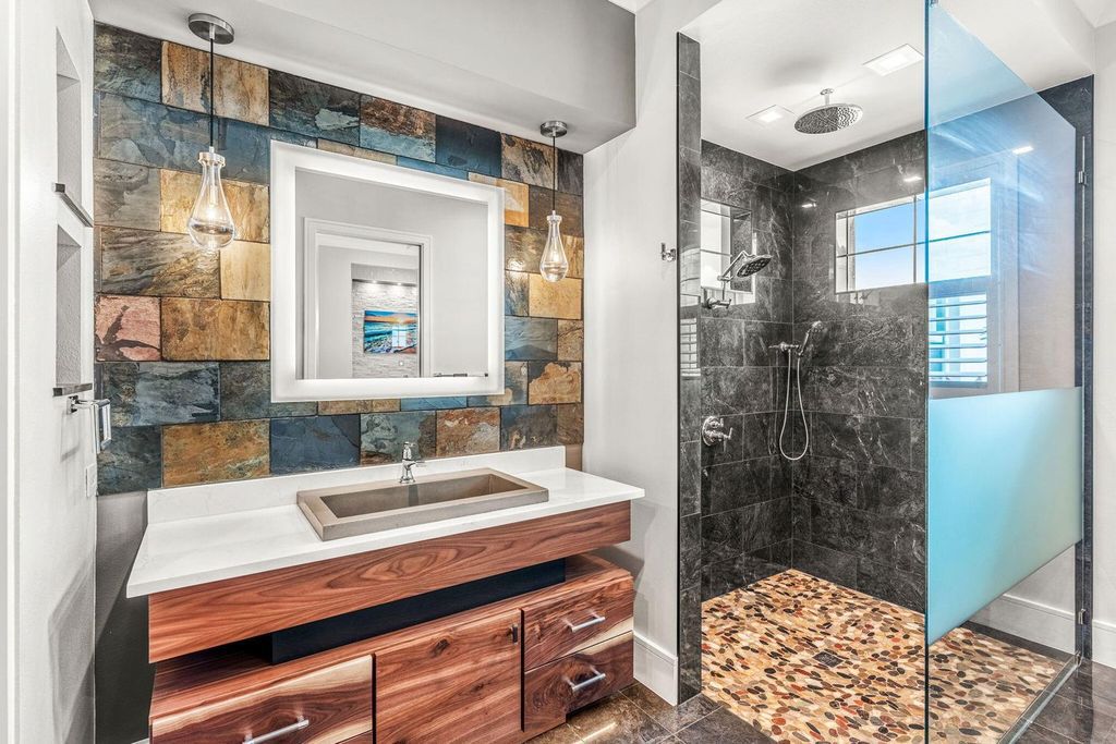 This brand-new 2024 lakefront estate, set on 0.75 acres, offers 4 bedrooms, 7 baths, and 6,299 square feet of refined living space.