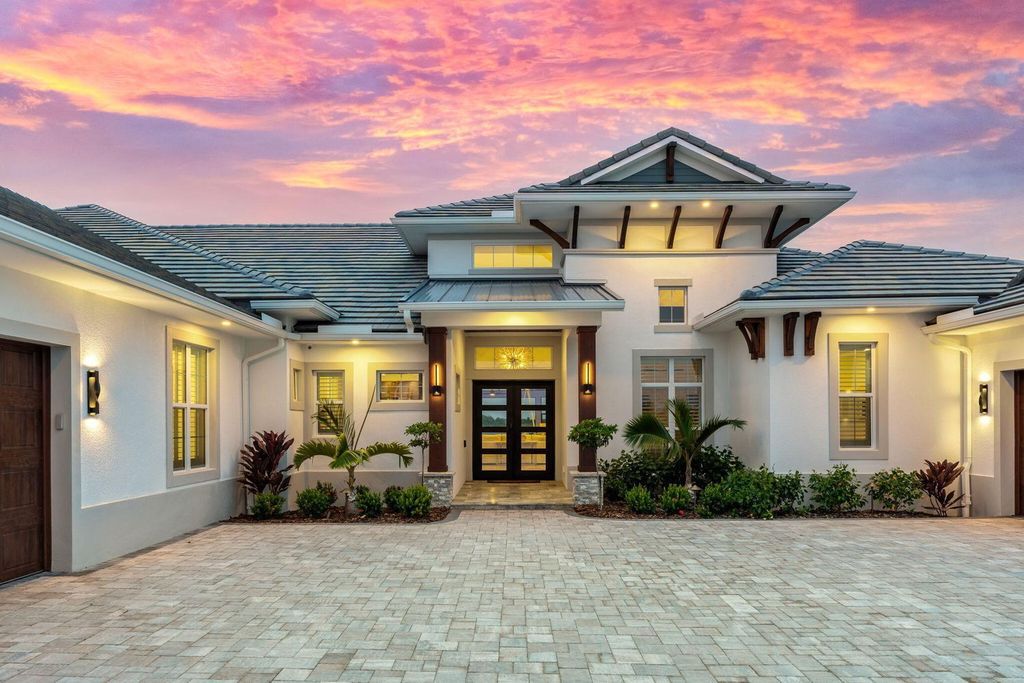 This brand-new 2024 lakefront estate, set on 0.75 acres, offers 4 bedrooms, 7 baths, and 6,299 square feet of refined living space.