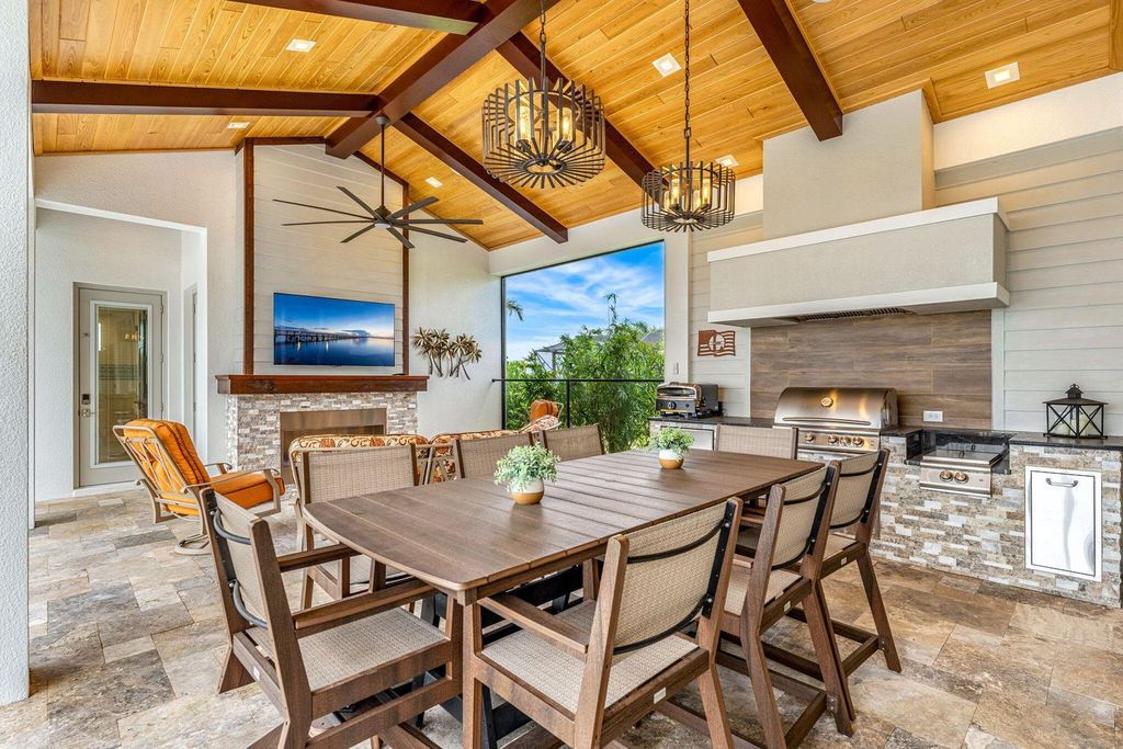 This brand-new 2024 lakefront estate, set on 0.75 acres, offers 4 bedrooms, 7 baths, and 6,299 square feet of refined living space.