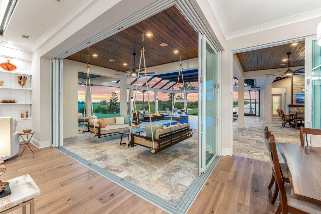 This brand-new 2024 lakefront estate, set on 0.75 acres, offers 4 bedrooms, 7 baths, and 6,299 square feet of refined living space.