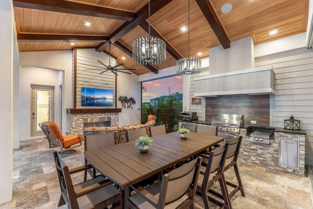 This brand-new 2024 lakefront estate, set on 0.75 acres, offers 4 bedrooms, 7 baths, and 6,299 square feet of refined living space.