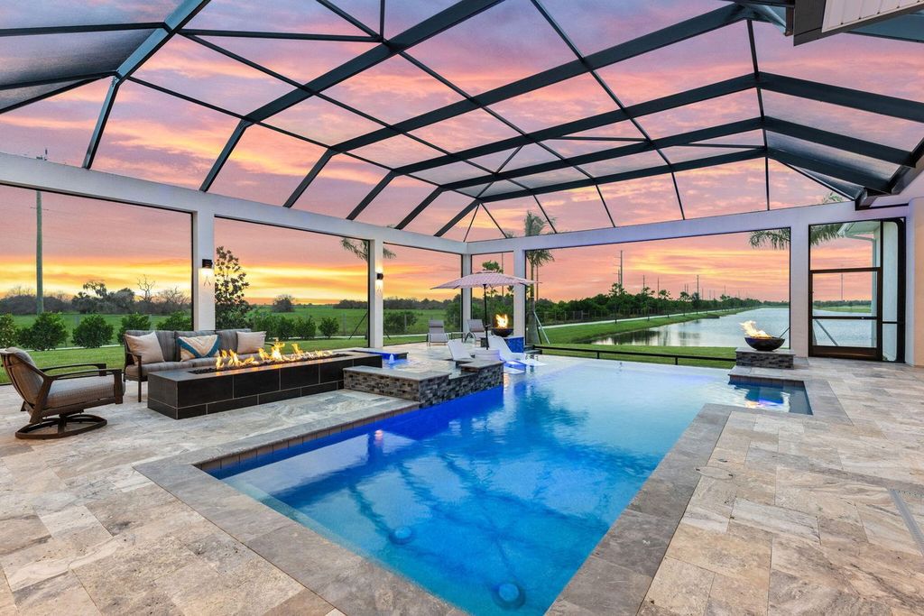 This brand-new 2024 lakefront estate, set on 0.75 acres, offers 4 bedrooms, 7 baths, and 6,299 square feet of refined living space.