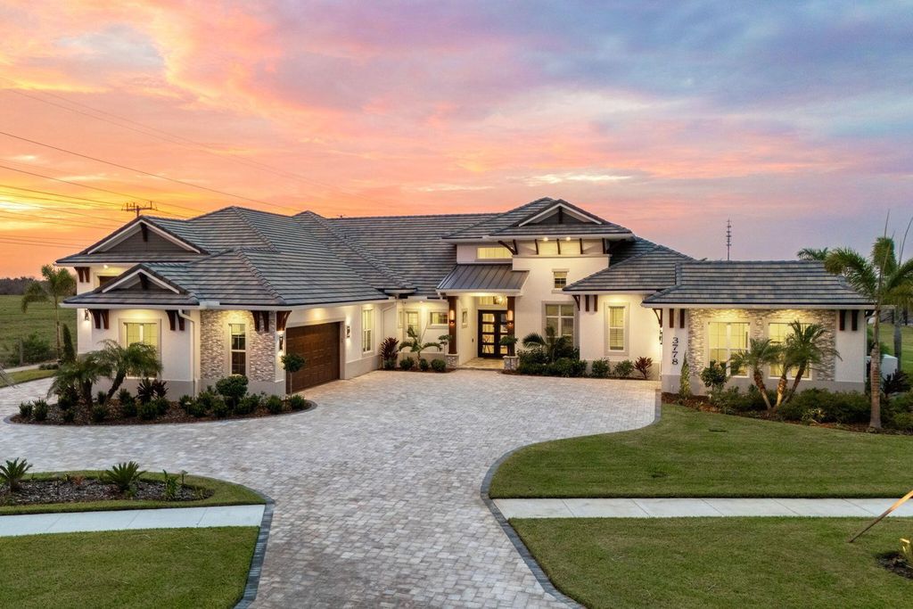 This brand-new 2024 lakefront estate, set on 0.75 acres, offers 4 bedrooms, 7 baths, and 6,299 square feet of refined living space.