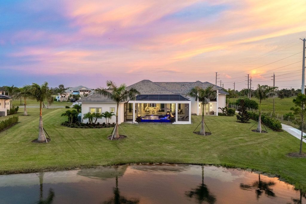 This brand-new 2024 lakefront estate, set on 0.75 acres, offers 4 bedrooms, 7 baths, and 6,299 square feet of refined living space.