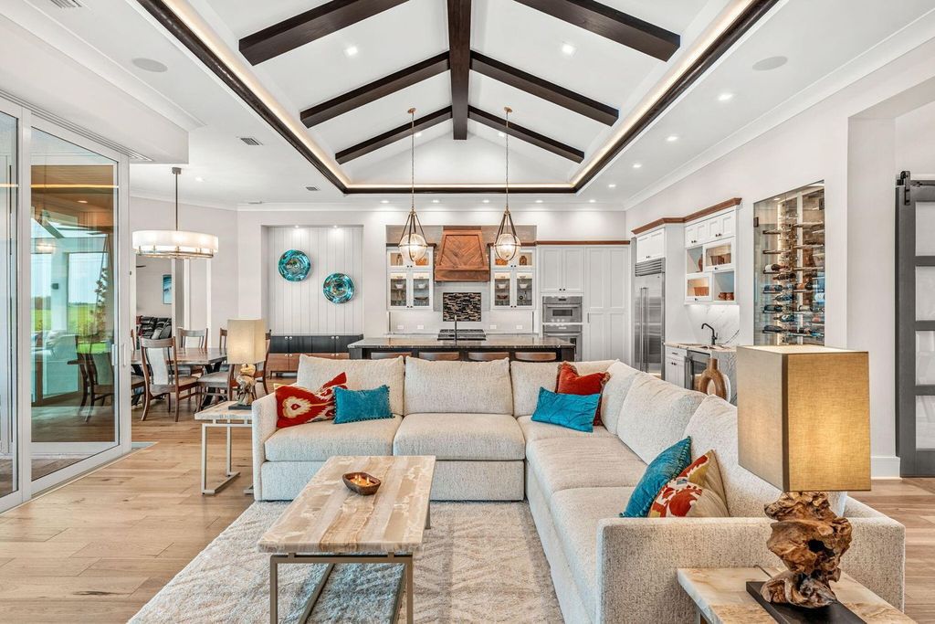 This brand-new 2024 lakefront estate, set on 0.75 acres, offers 4 bedrooms, 7 baths, and 6,299 square feet of refined living space.