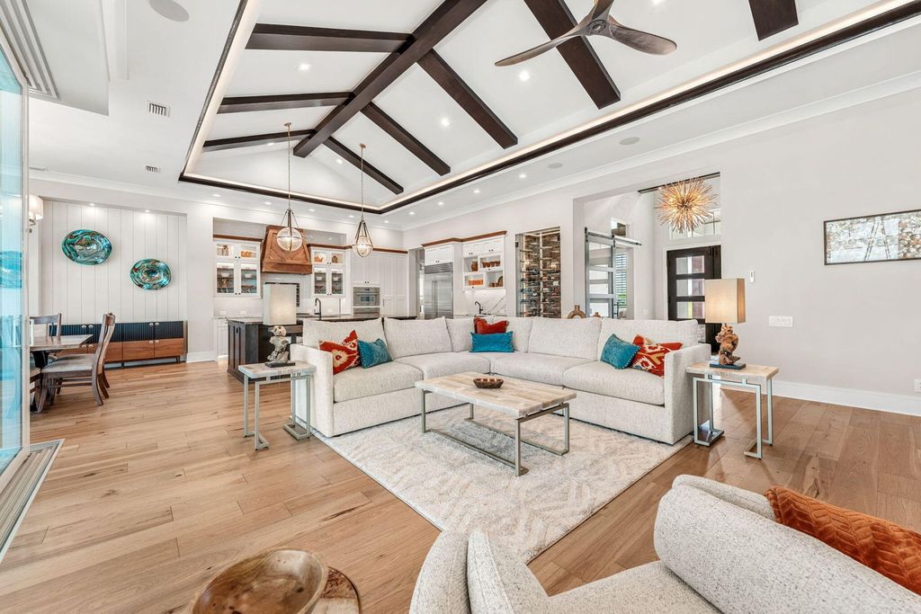 This brand-new 2024 lakefront estate, set on 0.75 acres, offers 4 bedrooms, 7 baths, and 6,299 square feet of refined living space.