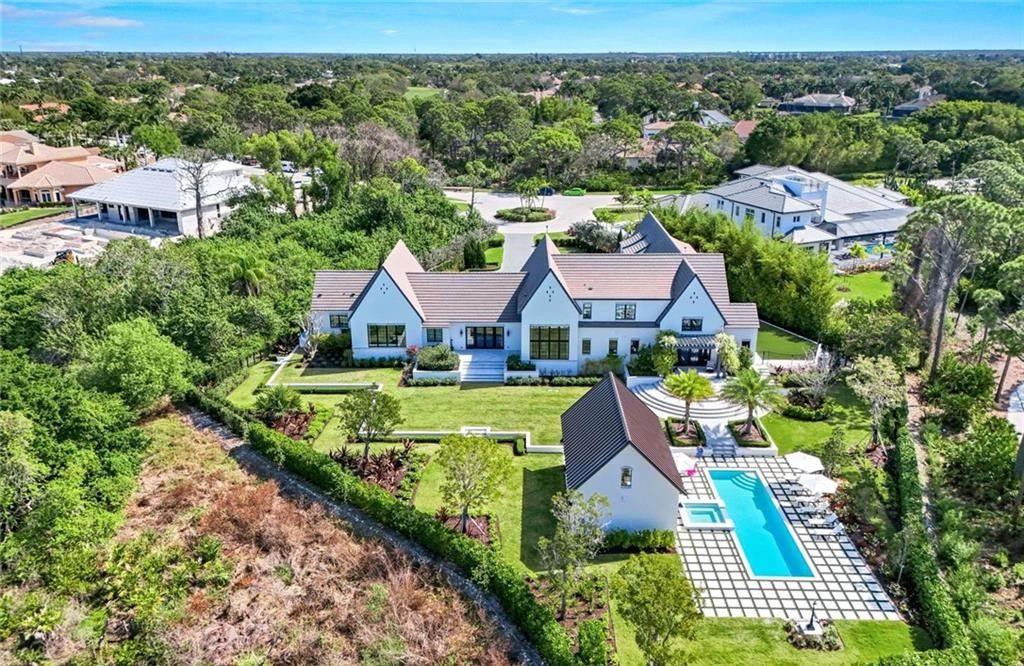 Set on nearly an acre in Audubon Country Club, this 4-bed, 6-bath home, designed by Renee Gaddis and built by the Williams Group, blends modern art deco with French countryside charm.