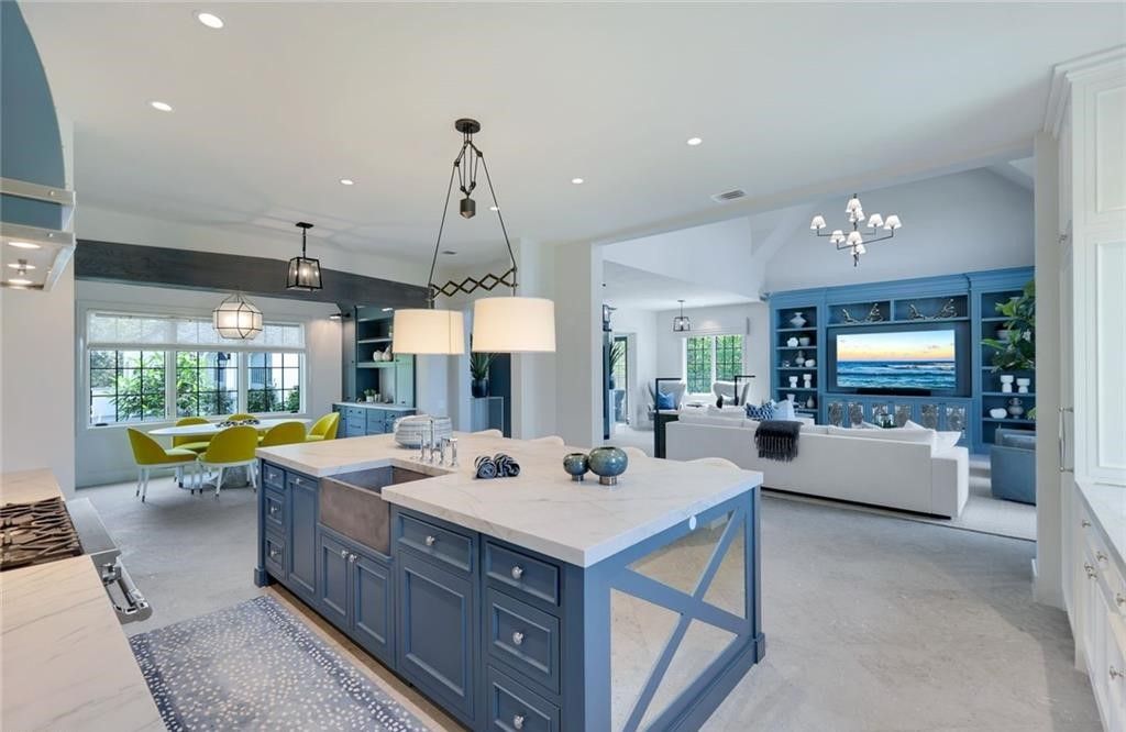 Set on nearly an acre in Audubon Country Club, this 4-bed, 6-bath home, designed by Renee Gaddis and built by the Williams Group, blends modern art deco with French countryside charm.