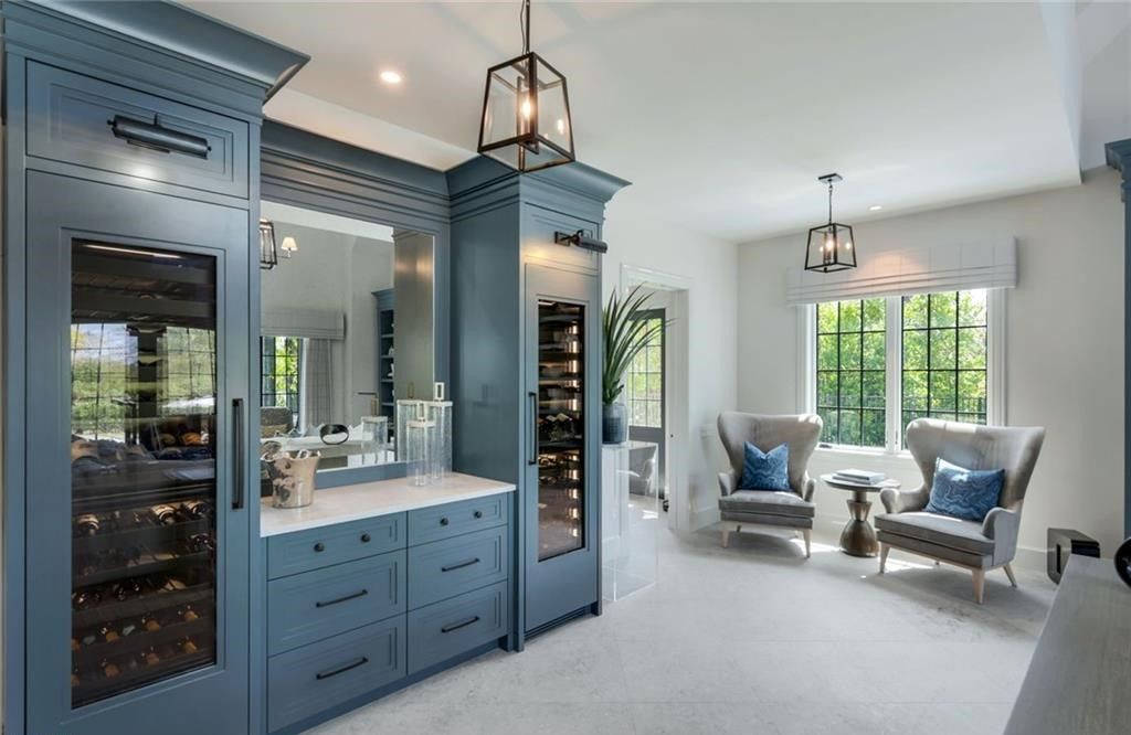 Set on nearly an acre in Audubon Country Club, this 4-bed, 6-bath home, designed by Renee Gaddis and built by the Williams Group, blends modern art deco with French countryside charm.