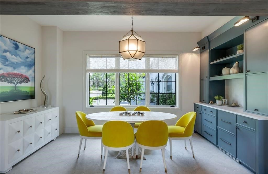 Set on nearly an acre in Audubon Country Club, this 4-bed, 6-bath home, designed by Renee Gaddis and built by the Williams Group, blends modern art deco with French countryside charm.