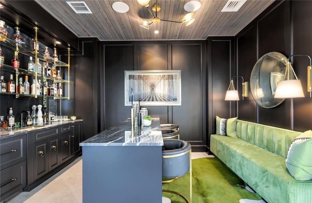 Set on nearly an acre in Audubon Country Club, this 4-bed, 6-bath home, designed by Renee Gaddis and built by the Williams Group, blends modern art deco with French countryside charm.
