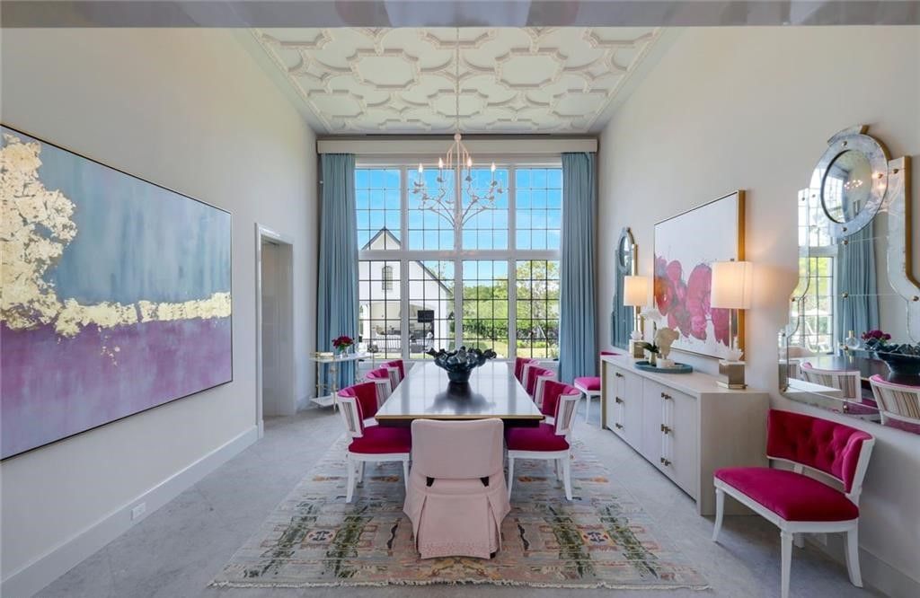 Set on nearly an acre in Audubon Country Club, this 4-bed, 6-bath home, designed by Renee Gaddis and built by the Williams Group, blends modern art deco with French countryside charm.