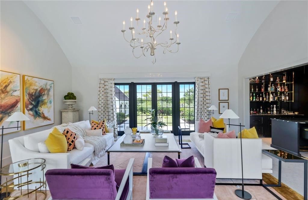 Set on nearly an acre in Audubon Country Club, this 4-bed, 6-bath home, designed by Renee Gaddis and built by the Williams Group, blends modern art deco with French countryside charm.