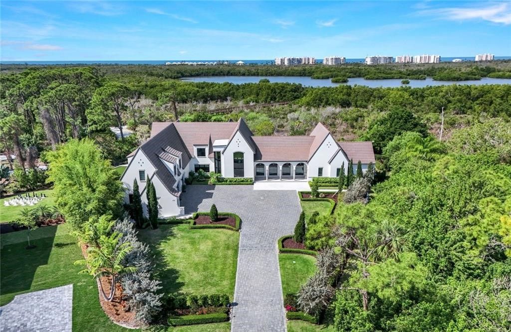 Set on nearly an acre in Audubon Country Club, this 4-bed, 6-bath home, designed by Renee Gaddis and built by the Williams Group, blends modern art deco with French countryside charm.