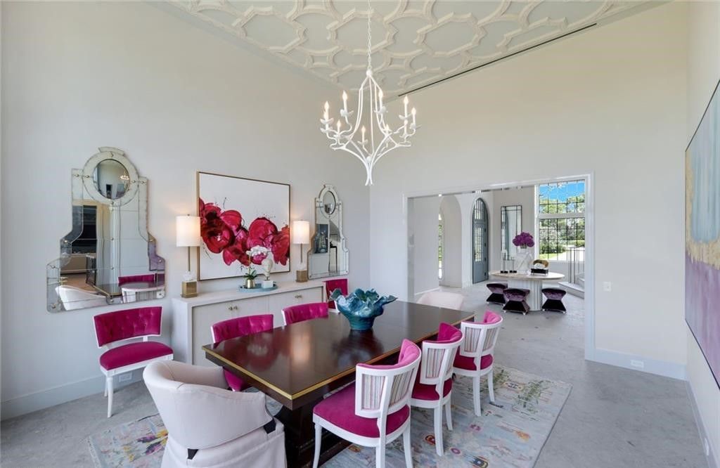 Set on nearly an acre in Audubon Country Club, this 4-bed, 6-bath home, designed by Renee Gaddis and built by the Williams Group, blends modern art deco with French countryside charm.