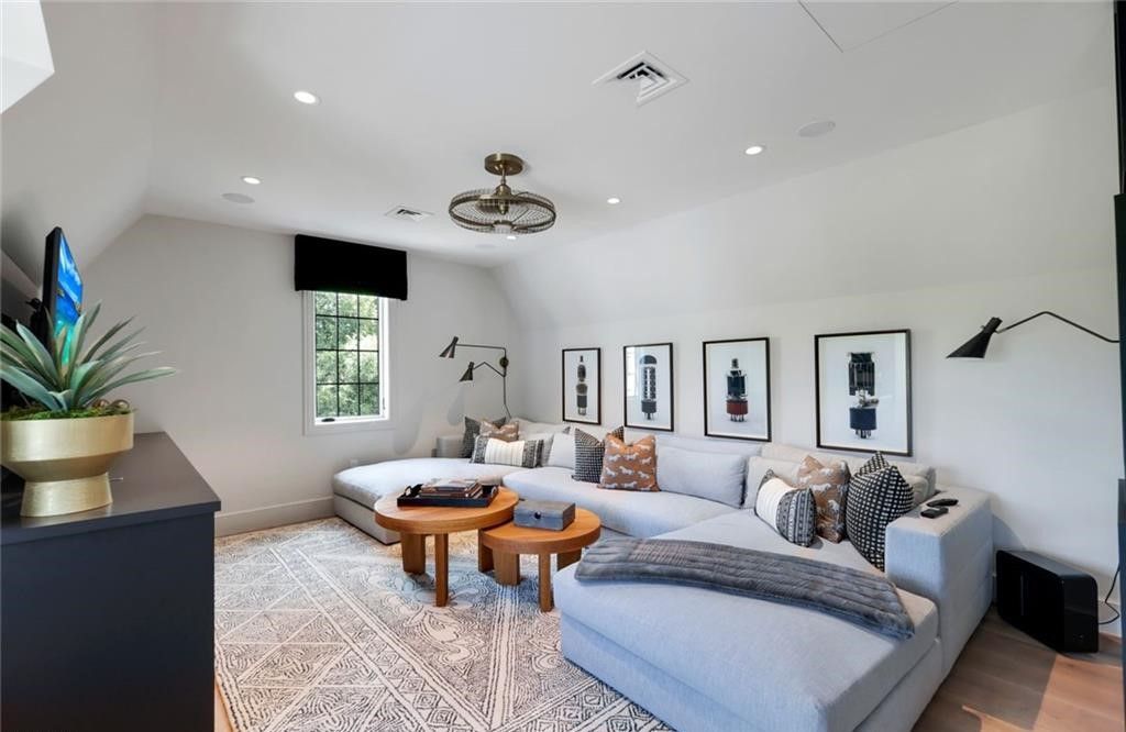 Set on nearly an acre in Audubon Country Club, this 4-bed, 6-bath home, designed by Renee Gaddis and built by the Williams Group, blends modern art deco with French countryside charm.