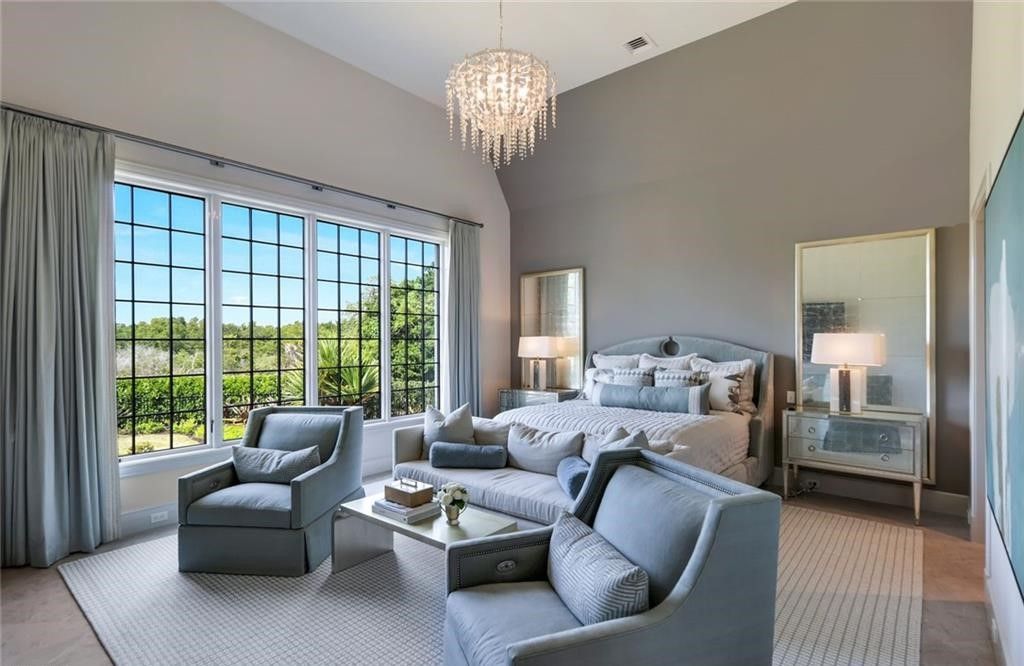 Set on nearly an acre in Audubon Country Club, this 4-bed, 6-bath home, designed by Renee Gaddis and built by the Williams Group, blends modern art deco with French countryside charm.