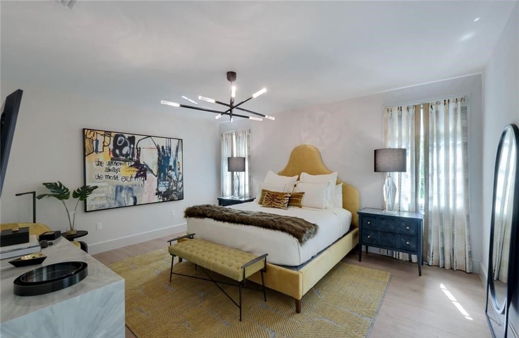 Set on nearly an acre in Audubon Country Club, this 4-bed, 6-bath home, designed by Renee Gaddis and built by the Williams Group, blends modern art deco with French countryside charm.