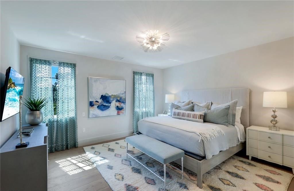 Set on nearly an acre in Audubon Country Club, this 4-bed, 6-bath home, designed by Renee Gaddis and built by the Williams Group, blends modern art deco with French countryside charm.