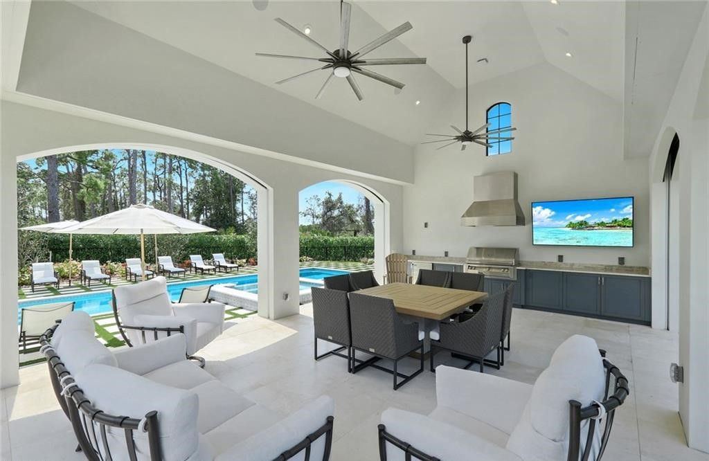 Set on nearly an acre in Audubon Country Club, this 4-bed, 6-bath home, designed by Renee Gaddis and built by the Williams Group, blends modern art deco with French countryside charm.