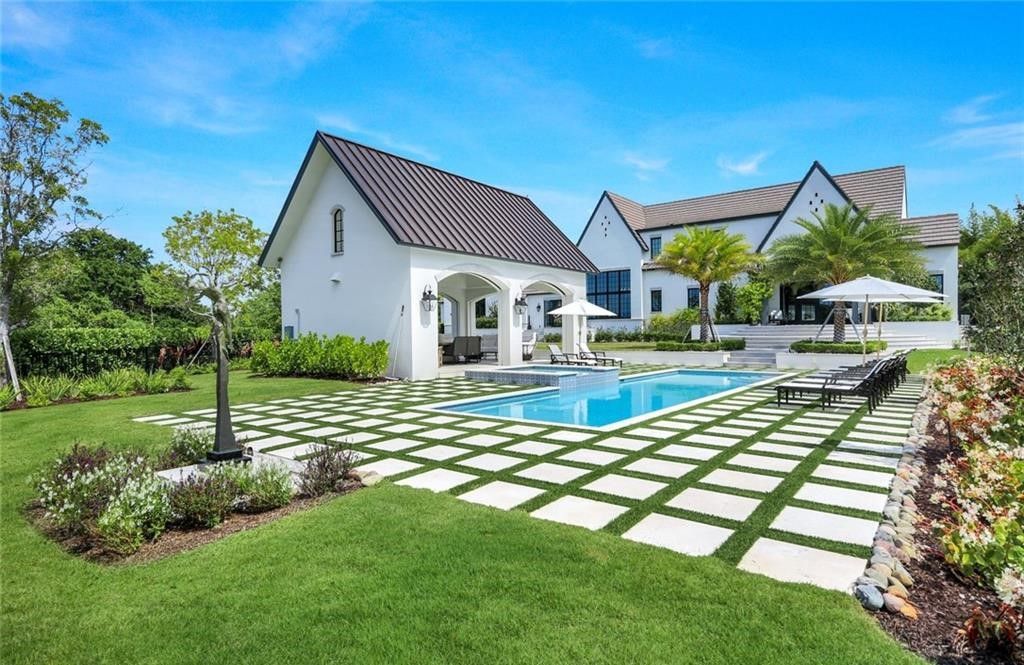 Set on nearly an acre in Audubon Country Club, this 4-bed, 6-bath home, designed by Renee Gaddis and built by the Williams Group, blends modern art deco with French countryside charm.