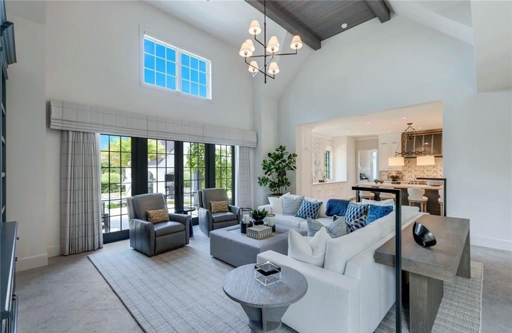 Set on nearly an acre in Audubon Country Club, this 4-bed, 6-bath home, designed by Renee Gaddis and built by the Williams Group, blends modern art deco with French countryside charm.