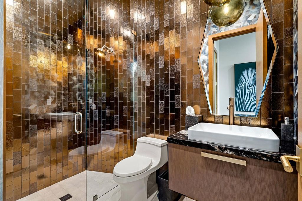 This modern Malibu-inspired estate in Boca Raton's exclusive Sanctuary community offers unparalleled luxury with 170 feet of protected waterfront.