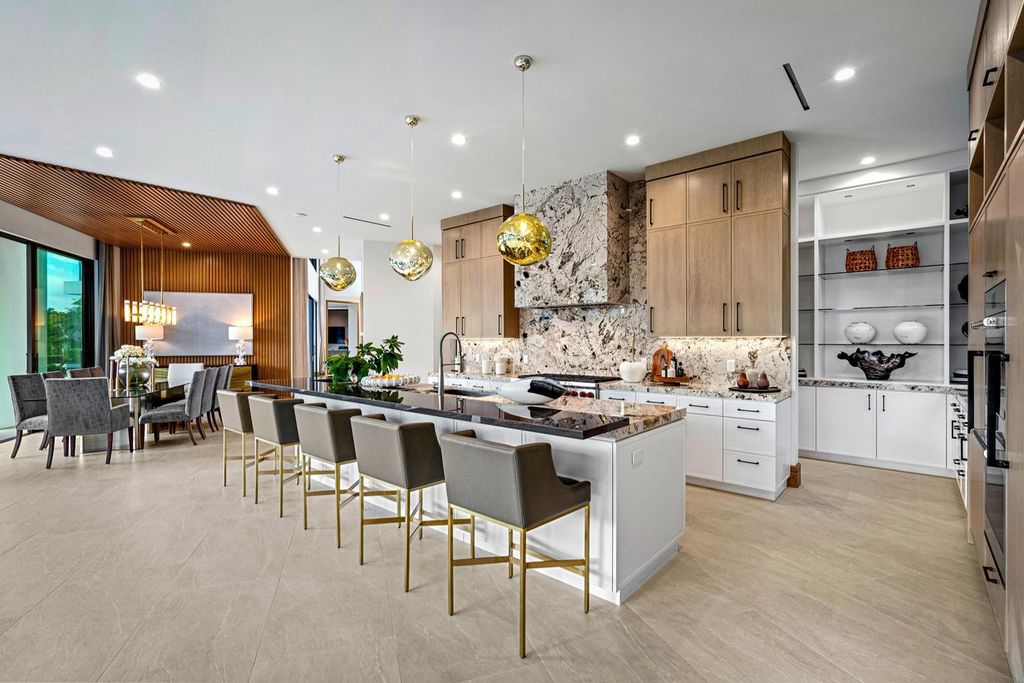 This modern Malibu-inspired estate in Boca Raton's exclusive Sanctuary community offers unparalleled luxury with 170 feet of protected waterfront.