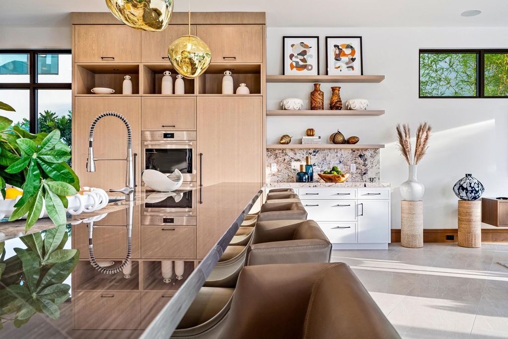 This modern Malibu-inspired estate in Boca Raton's exclusive Sanctuary community offers unparalleled luxury with 170 feet of protected waterfront.