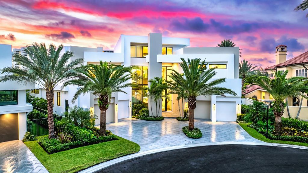 This modern Malibu-inspired estate in Boca Raton's exclusive Sanctuary community offers unparalleled luxury with 170 feet of protected waterfront.