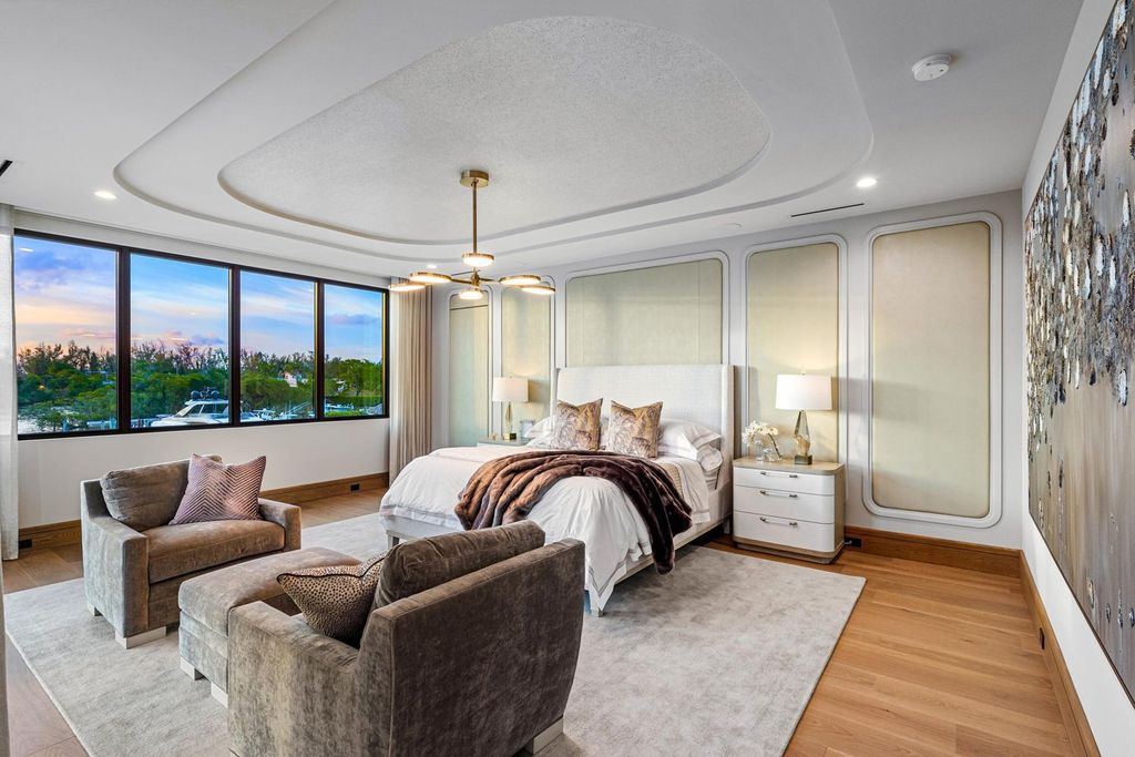This modern Malibu-inspired estate in Boca Raton's exclusive Sanctuary community offers unparalleled luxury with 170 feet of protected waterfront.