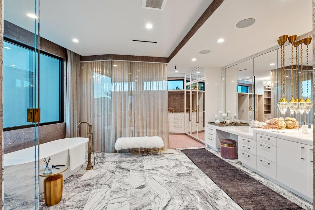 This modern Malibu-inspired estate in Boca Raton's exclusive Sanctuary community offers unparalleled luxury with 170 feet of protected waterfront.