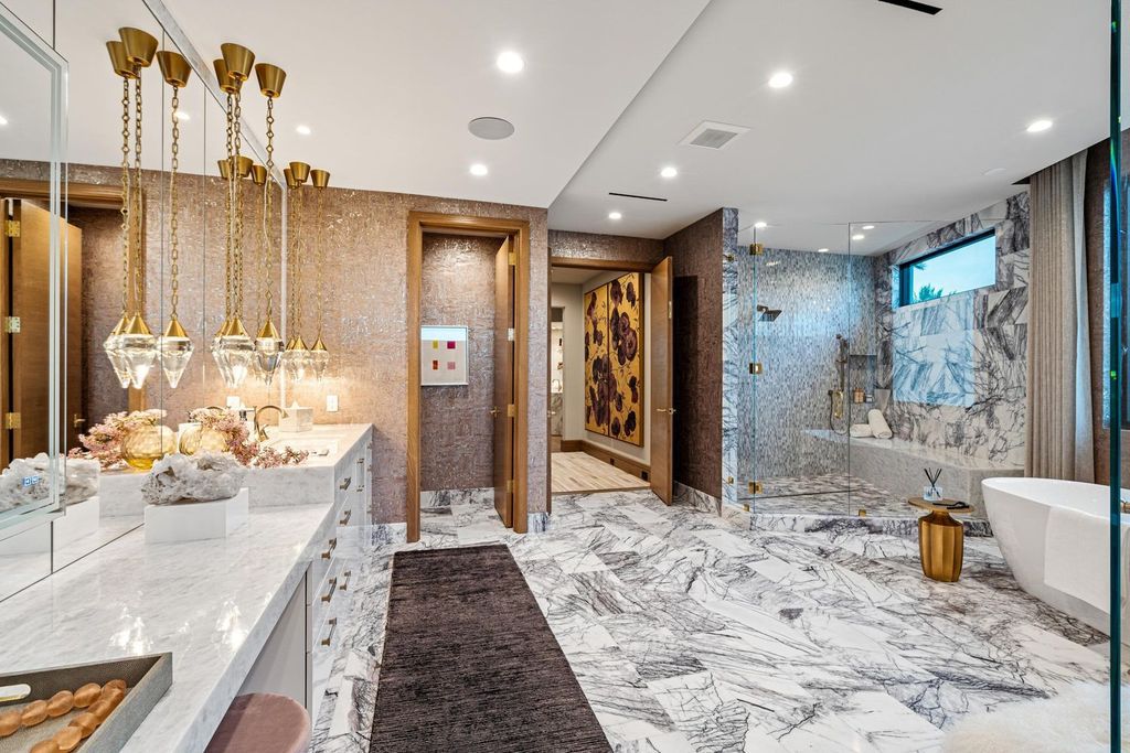 This modern Malibu-inspired estate in Boca Raton's exclusive Sanctuary community offers unparalleled luxury with 170 feet of protected waterfront.