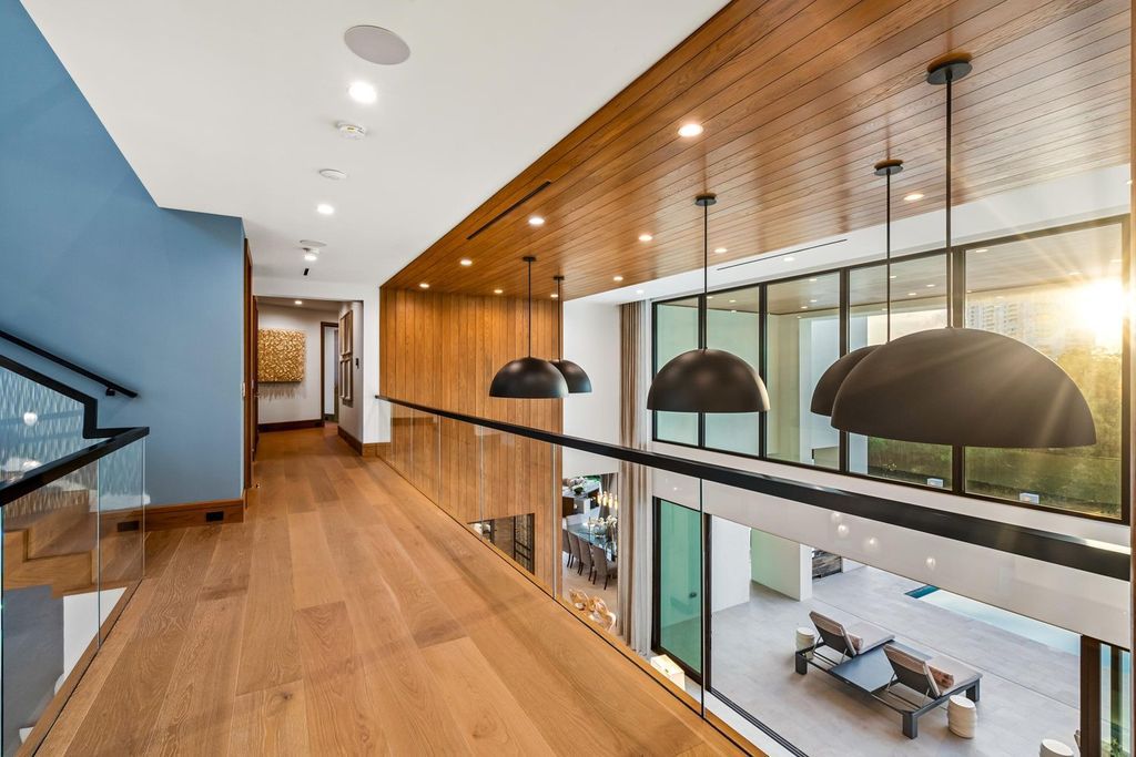This modern Malibu-inspired estate in Boca Raton's exclusive Sanctuary community offers unparalleled luxury with 170 feet of protected waterfront.