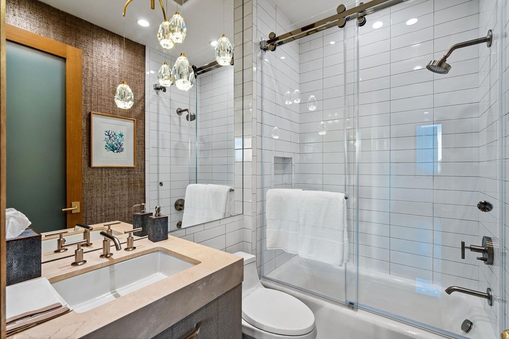 This modern Malibu-inspired estate in Boca Raton's exclusive Sanctuary community offers unparalleled luxury with 170 feet of protected waterfront.
