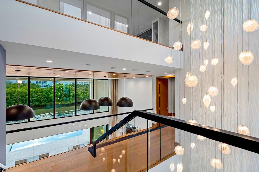 This modern Malibu-inspired estate in Boca Raton's exclusive Sanctuary community offers unparalleled luxury with 170 feet of protected waterfront.