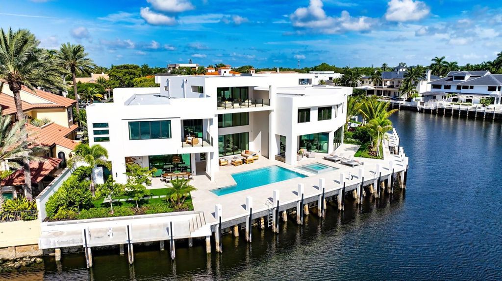 This modern Malibu-inspired estate in Boca Raton's exclusive Sanctuary community offers unparalleled luxury with 170 feet of protected waterfront.