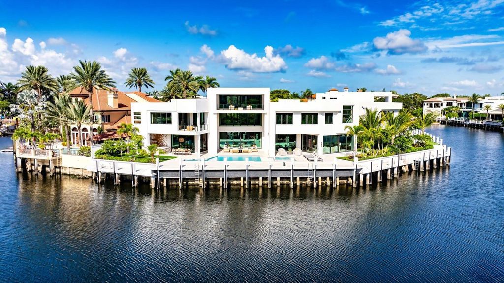 This modern Malibu-inspired estate in Boca Raton's exclusive Sanctuary community offers unparalleled luxury with 170 feet of protected waterfront.