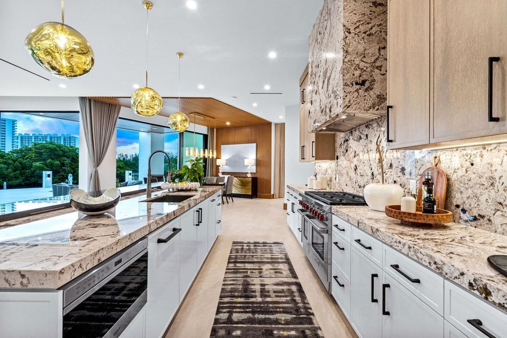 This modern Malibu-inspired estate in Boca Raton's exclusive Sanctuary community offers unparalleled luxury with 170 feet of protected waterfront.
