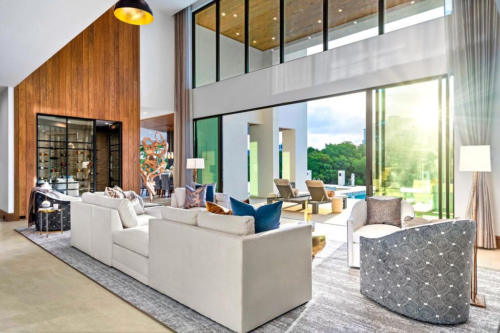 This modern Malibu-inspired estate in Boca Raton's exclusive Sanctuary community offers unparalleled luxury with 170 feet of protected waterfront.