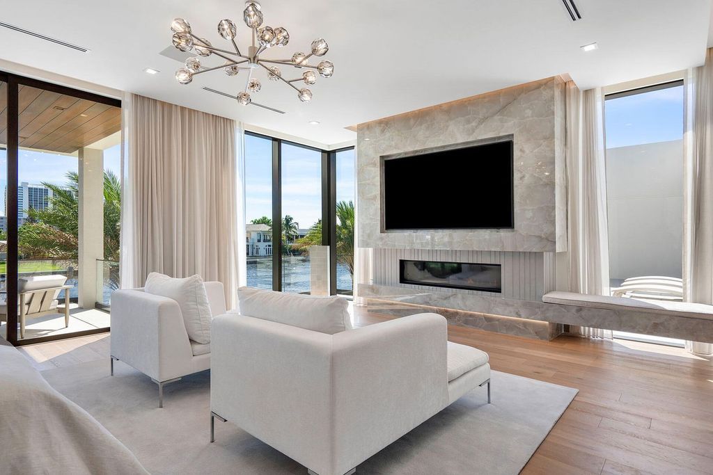 Experience elite Intracoastal living in this stunning turn-key Signature Estate by SRD Building Corp. Built in 2022, this 5-bedroom, 8-bath masterpiece spans over 8,200 square feet of luxurious living space, featuring a 4-car plus golf cart garage, resort-style pool, and 100 feet of prime waterfront with a private dock and Jet Ski lift.
