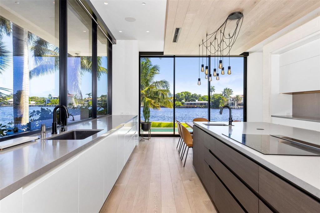 Experience unmatched luxury at 516 Mola Ave, a gated peninsula estate designed by Max Strang and built by Bomar Builders.