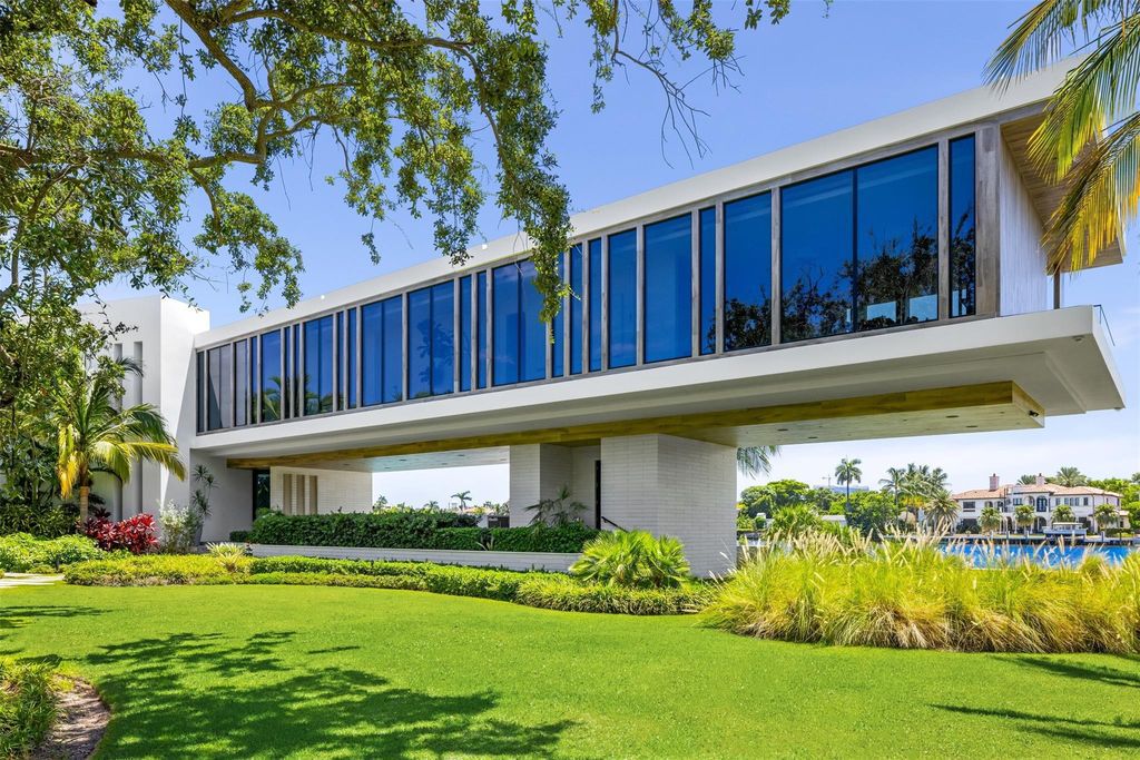 Experience unmatched luxury at 516 Mola Ave, a gated peninsula estate designed by Max Strang and built by Bomar Builders.